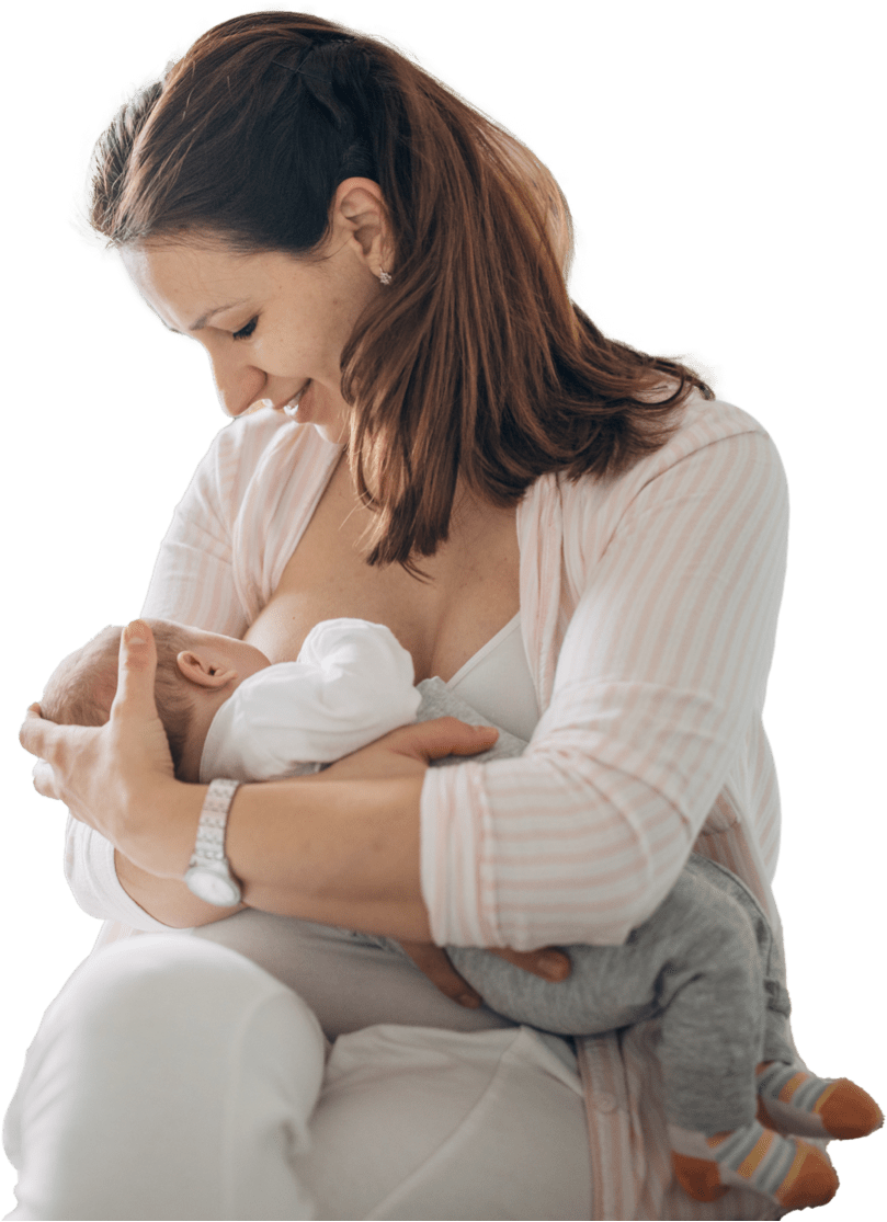 Mother breastfeeding her baby boy at home